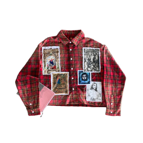 Red plaid shirt with printed images on a concrete surface